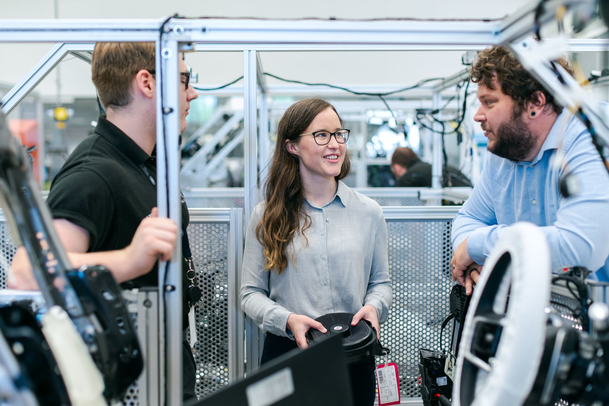 Engineers in conversation in a manufacturing environment